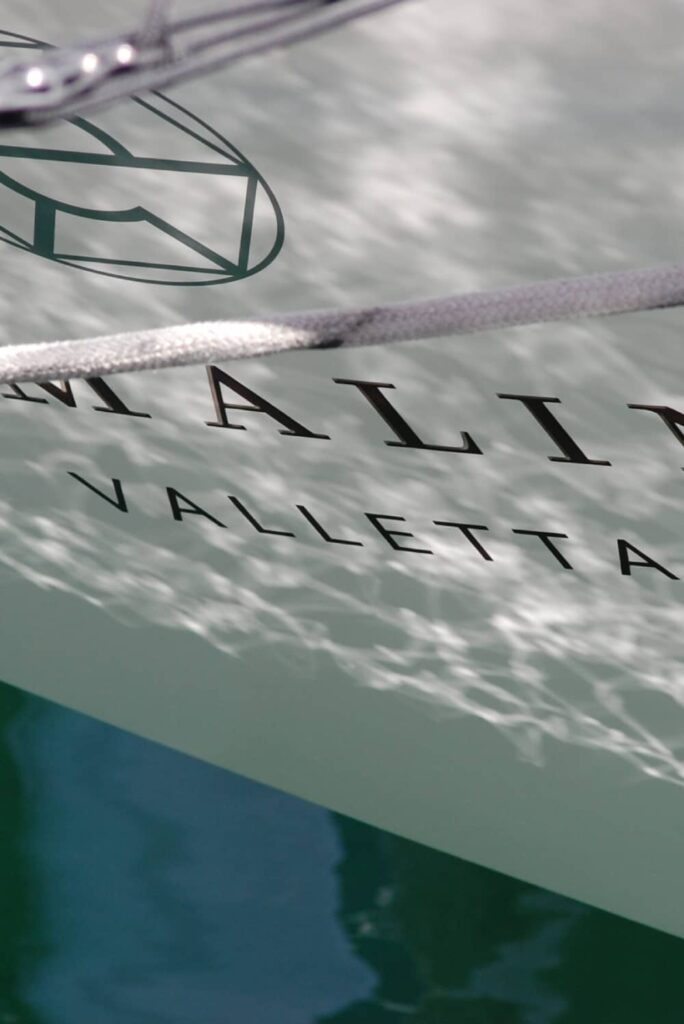 close up of a superyacht hull by a qualified marine surveyor prior to specialized certification and survey services